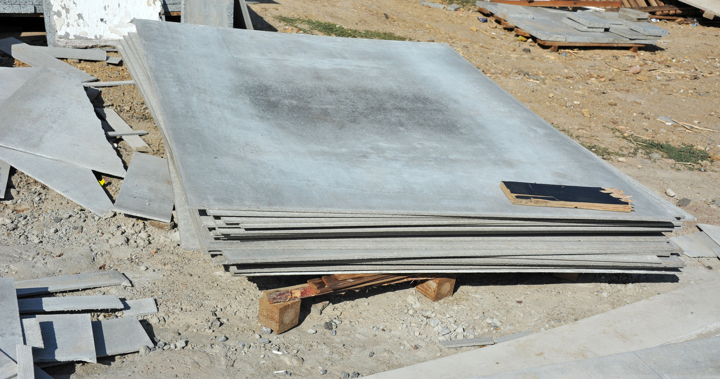 Asbestos wall boards at a demolition site