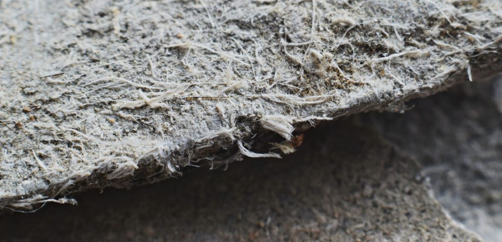 Asbestos fiber roofing material