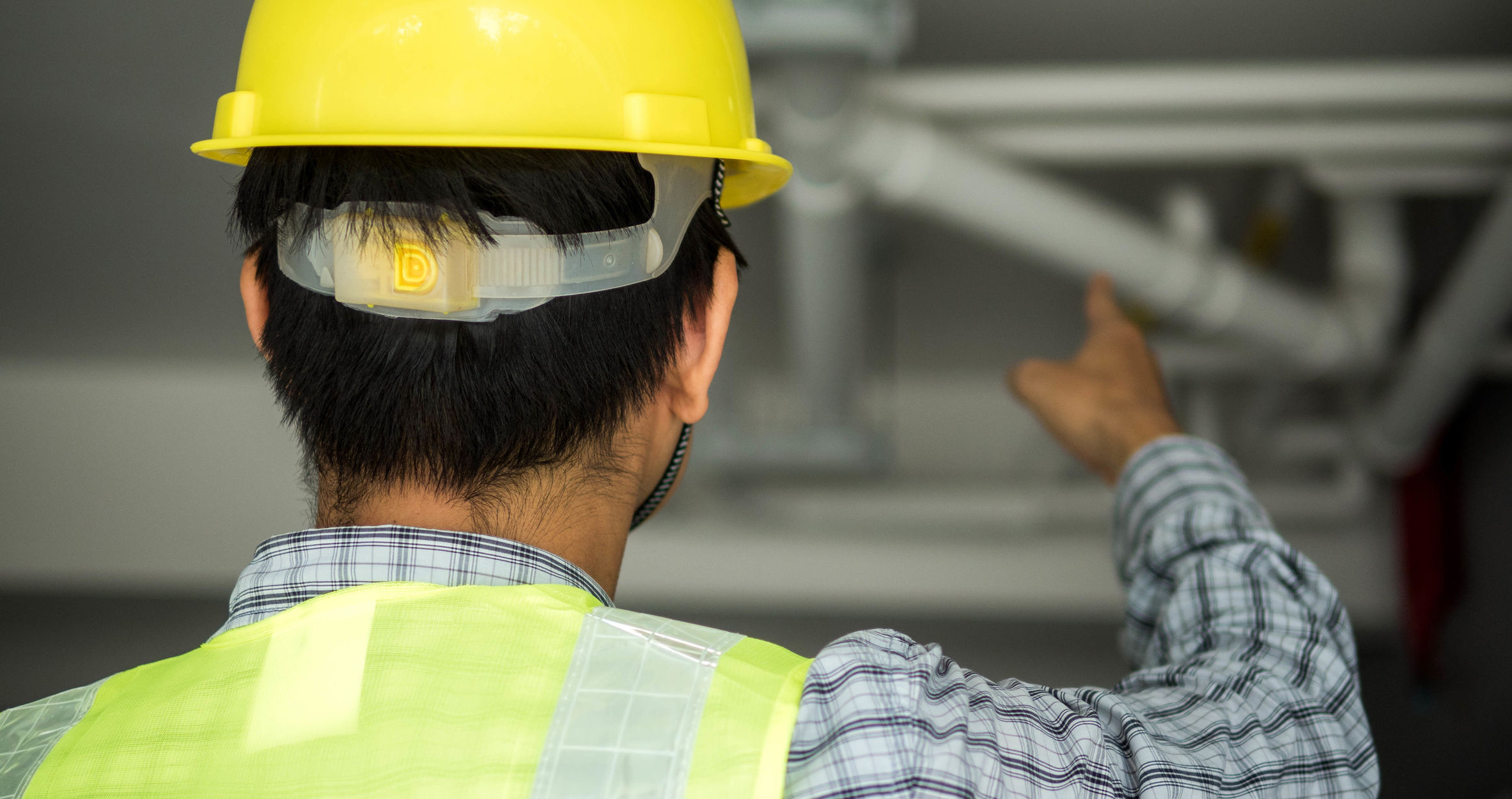 Engineer and Architect working at Construction Site