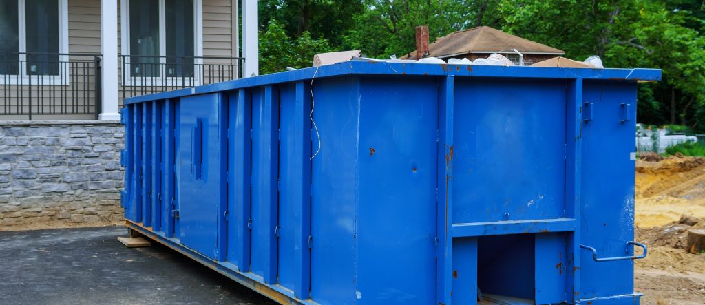 Dumpster full of demolition debris