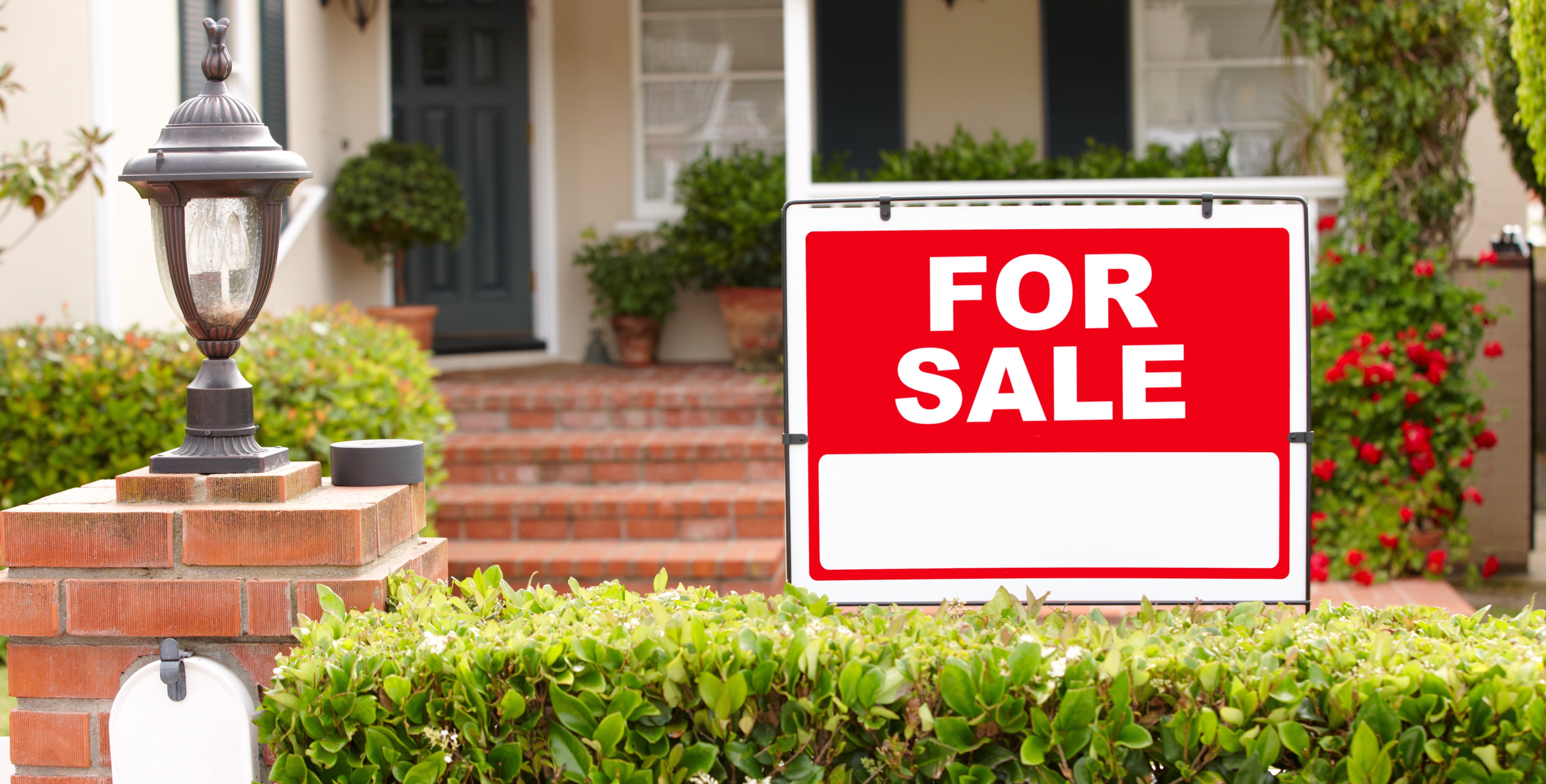 For sale sign outside a home on the market