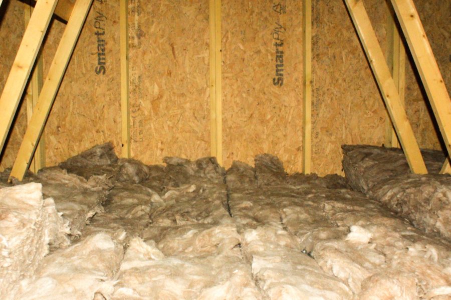 Insulation lining the roof of a residential attic